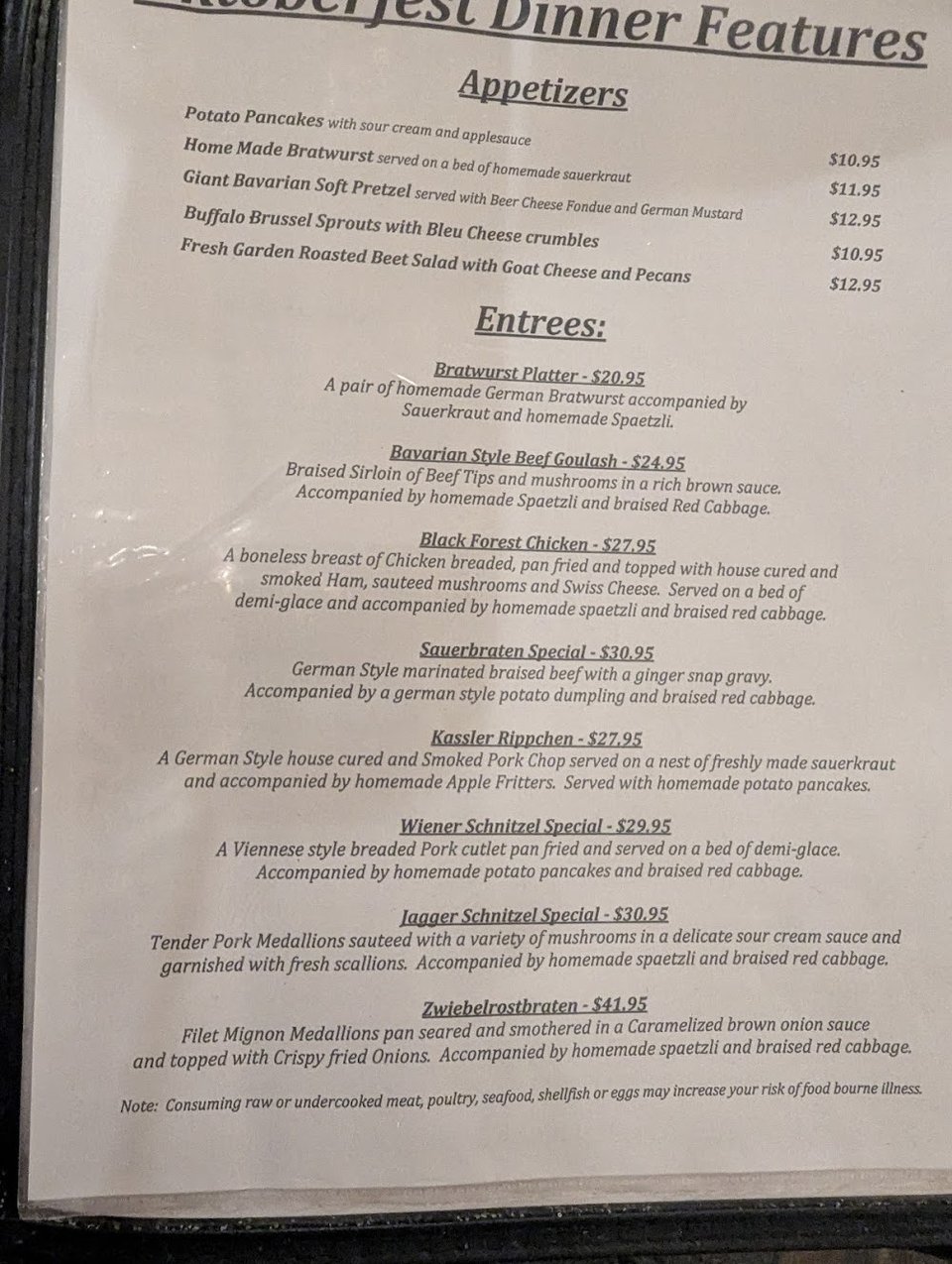 Printed menu with beverages, salads, and sandwiches.